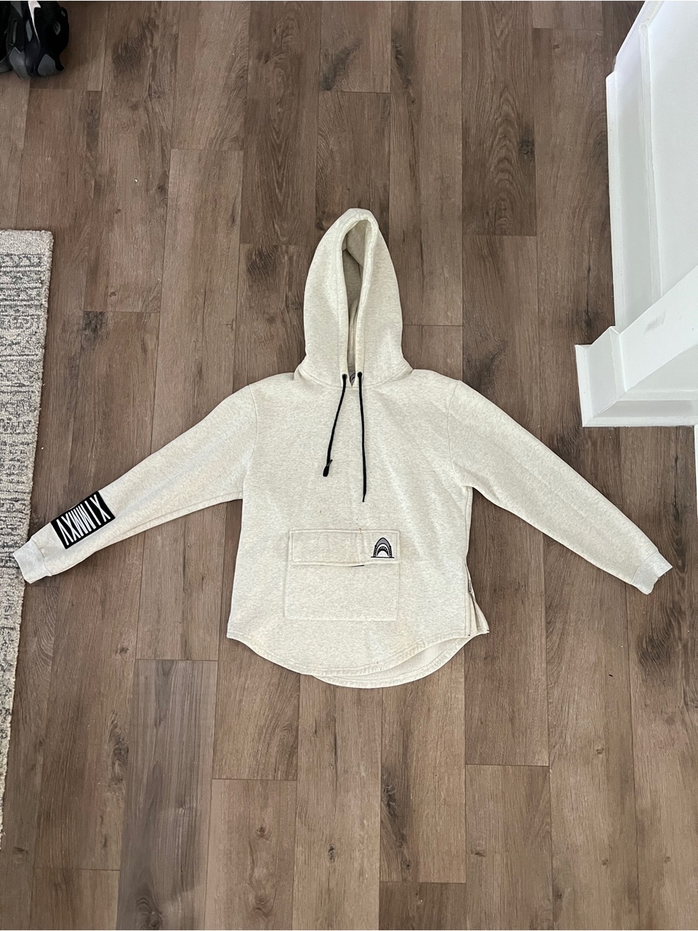 Tiger Shvrk Cream Hoodie Sweater with Front Pocket and zipper sides.